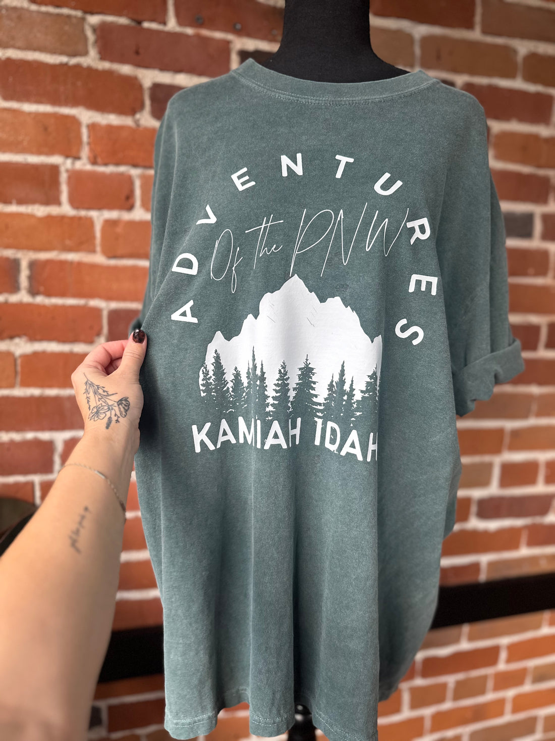 Adventures of the PNW Kamiah Idaho Teal and Black Splatter Tee